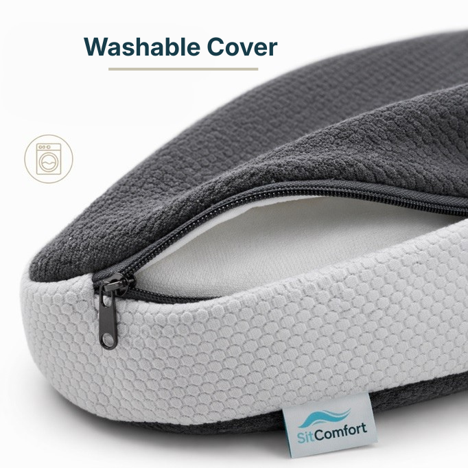 Gray and white pillow with washable cover and SitComfort branding.