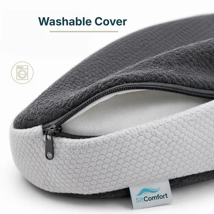 Gray and white pillow with washable cover and SitComfort branding.
